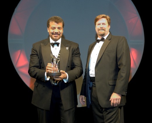 Communicator Award Dr. Neil deGrasse Tyson and presenter Jeffrey Carr.