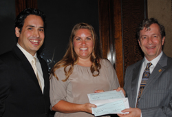 RNASA Foundation President Rodolfo González (left), Stacey Welch - Education Specialist from Texas A&M, (center) and RNASA Foundation Treasurer Geoff Atwater (right) presenting a check to Stacey Welch