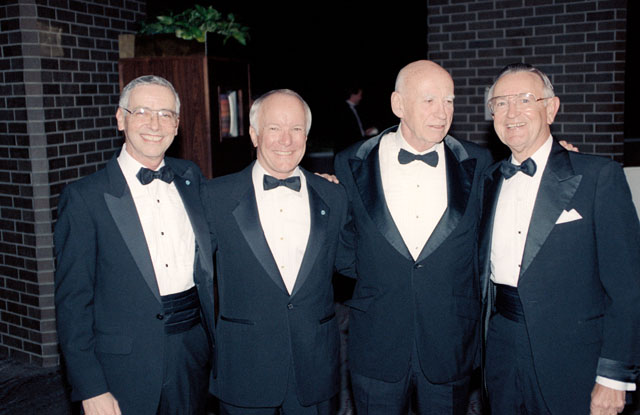 Gerald Griffin, Bob Gilruth, & Chris Kraft congratulate Aaron Cohen