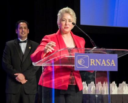 Houston Mayor Parker addresses crowd with RNASA Chairman Gonzales listening.