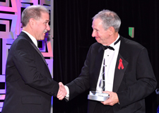 Dr. Michael Griffin (right) congratulates Dr. John Grunsfeld (left) for winning the National Space Trophy